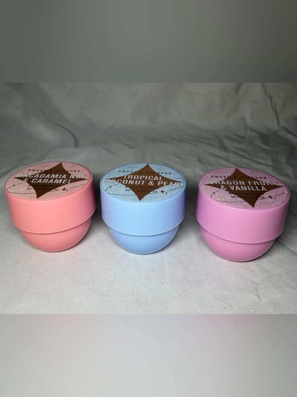 3 small tubes of different scented lotions